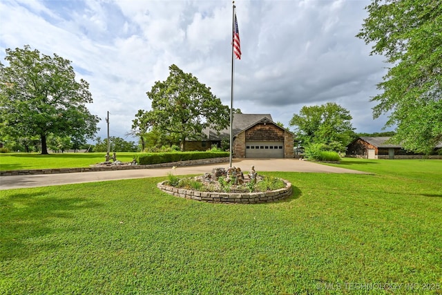 32069 Meadow Ln, Mannford, OK 74044 - view of front of property with a garage, a front yard, and curved driveway