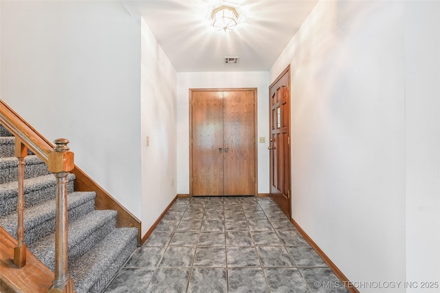 32069 Meadow Ln, Mannford, OK 74044 - entrance foyer with stone finish floors and stairway