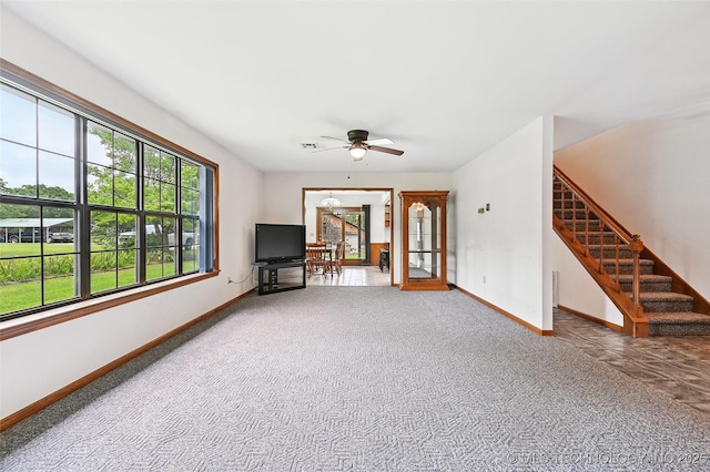 32069 Meadow Ln, Mannford, OK 74044 - unfurnished living room with ceiling fan, carpet floors, and stairway