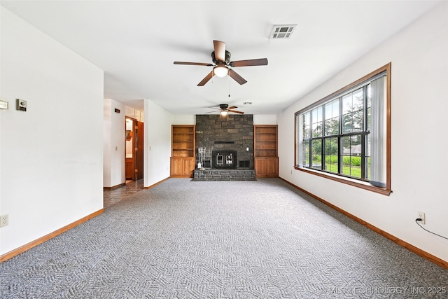 32069 Meadow Ln, Mannford, OK 74044 - unfurnished living room with a ceiling fan, carpet flooring, and a fireplace