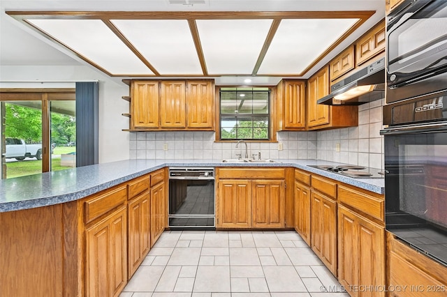 32069 Meadow Ln, Mannford, OK 74044 - kitchen with black appliances, brown cabinets, and light tile patterned floors