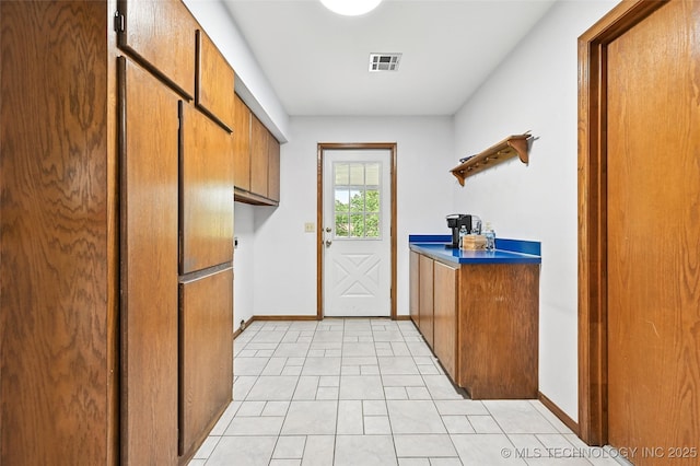 32069 Meadow Ln, Mannford, OK 74044 - doorway to outside featuring baseboards and light tile patterned floors