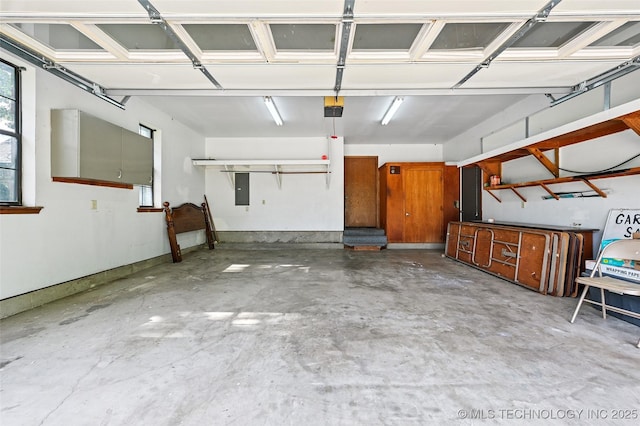 32069 Meadow Ln, Mannford, OK 74044 - garage featuring a garage door opener and electric panel