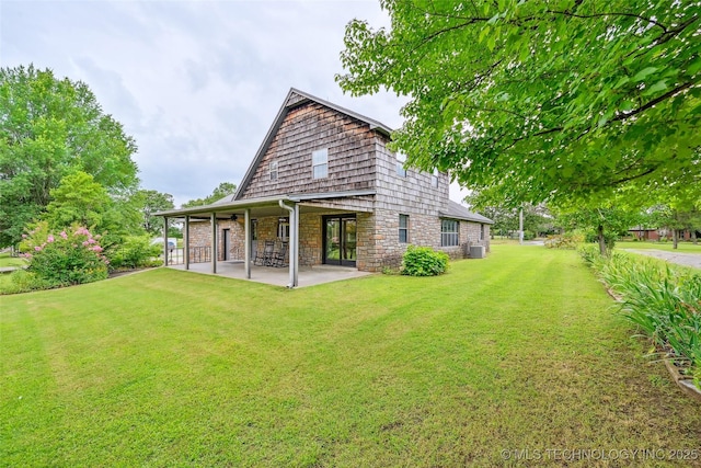 32069 Meadow Ln, Mannford, OK 74044 - back of house with stone siding, a lawn, and a patio area
