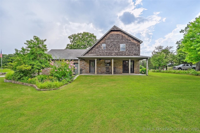 32069 Meadow Ln, Mannford, OK 74044 - rear view of house featuring stone siding, a yard, a ceiling fan, and a patio area
