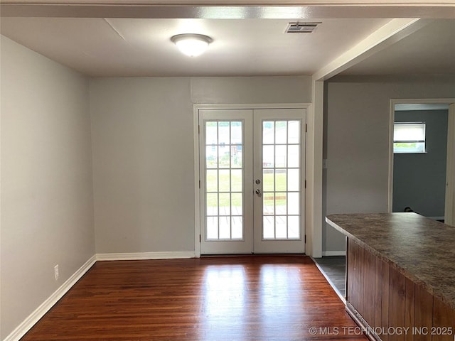 5940 E 3rd St, Tulsa, OK 74112 - doorway to outside featuring french doors, healthy amount of natural light, and dark wood-type flooring