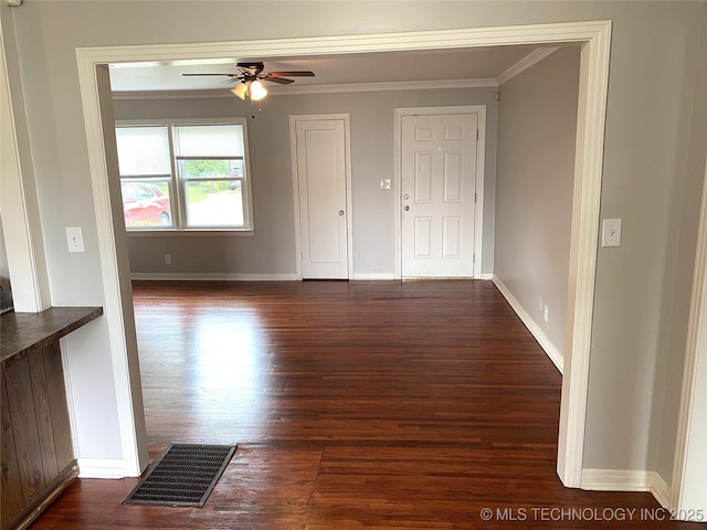 5940 E 3rd St, Tulsa, OK 74112 - unfurnished living room with crown molding, dark wood-type flooring, and ceiling fan