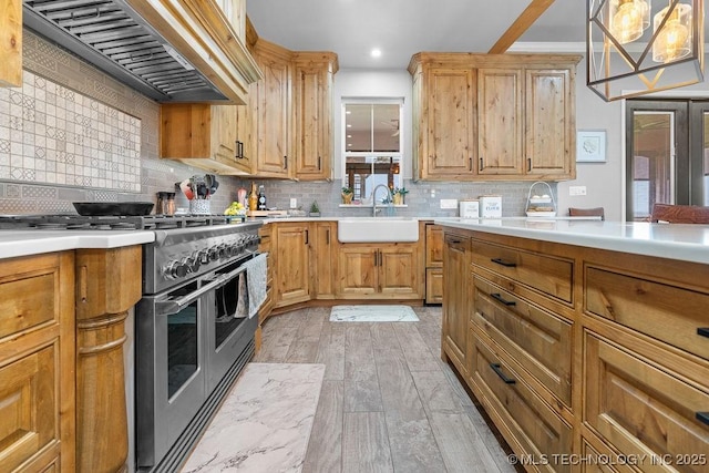 2724 Lark Rd, Kingston, OK 73439 - kitchen with double oven range, custom exhaust hood, decorative backsplash, light countertops, and light wood finished floors