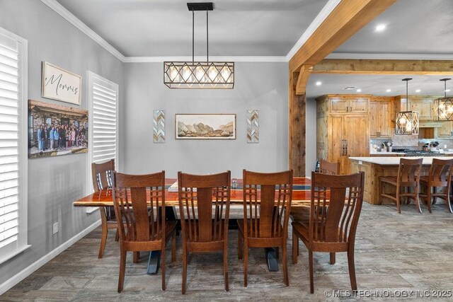 2724 Lark Rd, Kingston, OK 73439 - dining area with crown molding, light wood-type flooring, and healthy amount of natural light