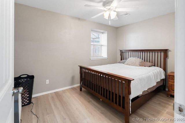2724 Lark Rd, Kingston, OK 73439 - bedroom with wood finished floors and a ceiling fan