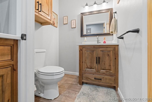 2724 Lark Rd, Kingston, OK 73439 - half bath featuring vanity and wood finished floors