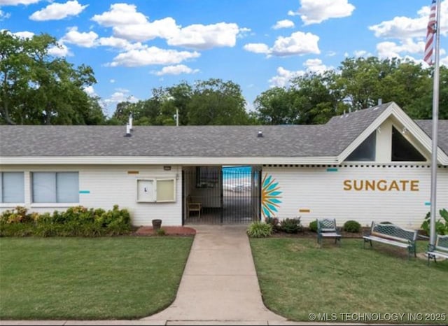 6740 E 51st Pl, Tulsa, OK 74145 - view of front of home with a front yard and roof with shingles