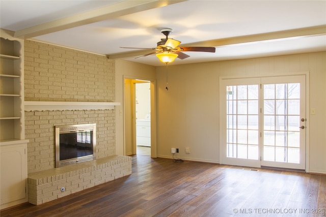 6740 E 51st Pl, Tulsa, OK 74145 - unfurnished living room featuring ceiling fan, plenty of natural light, wood finished floors, and a brick fireplace