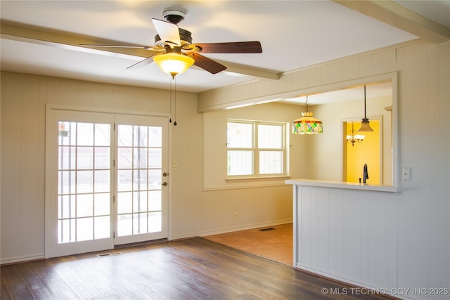 6740 E 51st Pl, Tulsa, OK 74145 - unfurnished room with wood finished floors and a ceiling fan