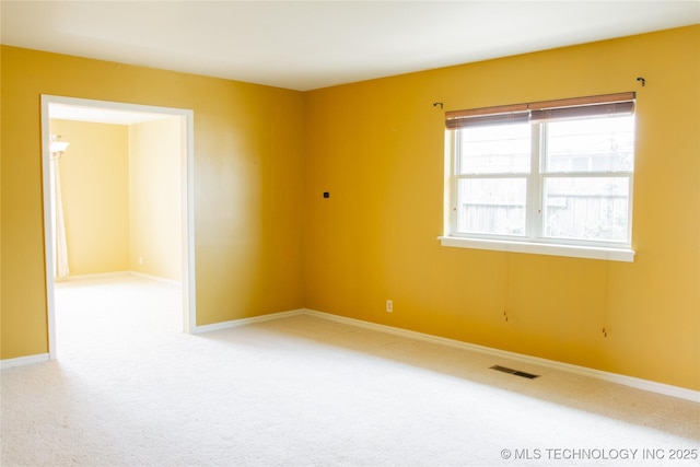 6740 E 51st Pl, Tulsa, OK 74145 - carpeted spare room with baseboards