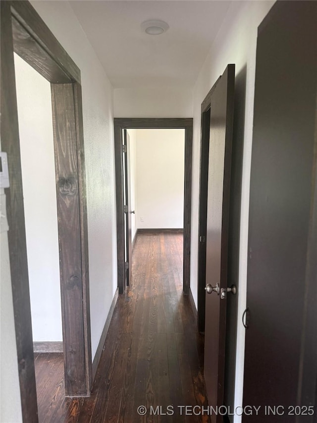 426 S 12th, Durant, OK 74701 - hallway with dark wood finished floors and baseboards