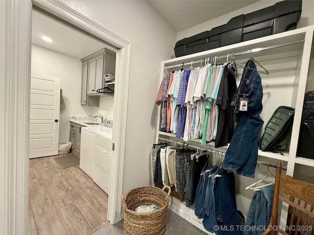 18040 County Road 1558, Ada, OK 74820 - laundry area with cabinet space and light wood-style floors