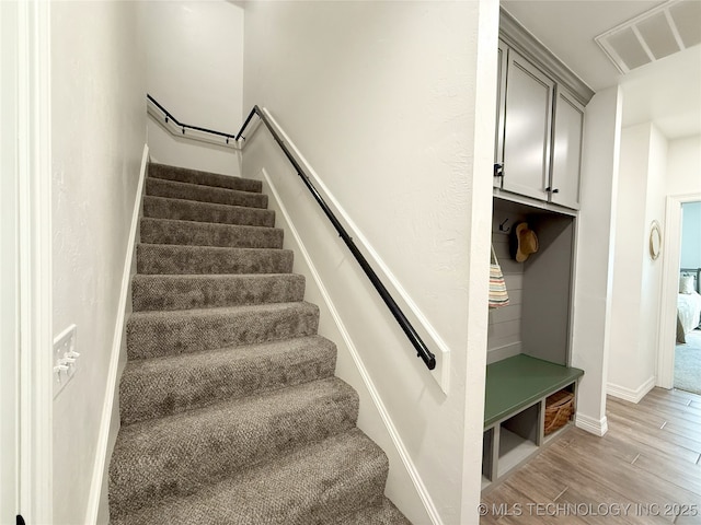 18040 County Road 1558, Ada, OK 74820 - staircase with wood finished floors and baseboards