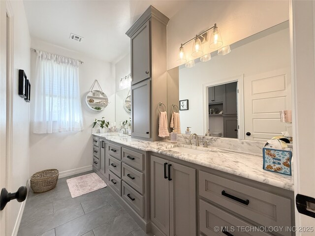 18040 County Road 1558, Ada, OK 74820 - full bathroom with double vanity and tile patterned floors