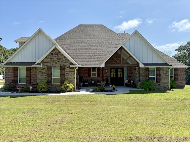 18040 County Road 1558, Ada, OK 74820 - craftsman house featuring board and batten siding, a front yard, and a shingled roof