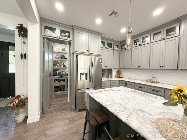 18040 County Road 1558, Ada, OK 74820 - kitchen featuring stainless steel refrigerator with ice dispenser, gray cabinetry, light wood finished floors, and recessed lighting