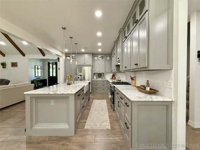 18040 County Road 1558, Ada, OK 74820 - kitchen featuring stainless steel appliances, gray cabinetry, open floor plan, decorative backsplash, and beamed ceiling