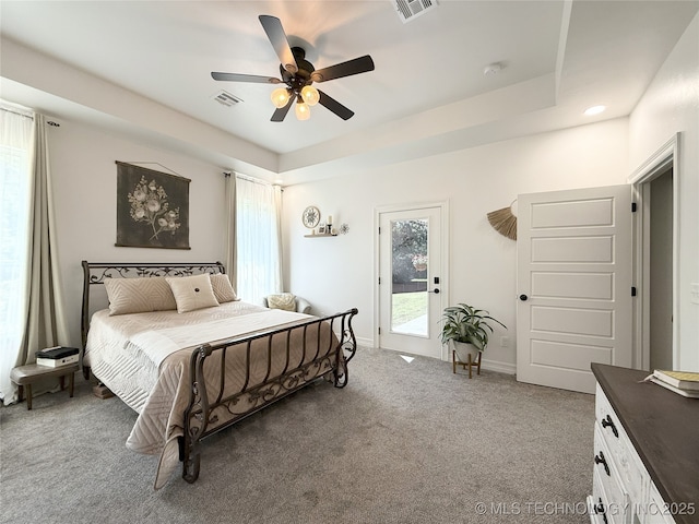 18040 County Road 1558, Ada, OK 74820 - bedroom with access to exterior, carpet, ceiling fan, and a raised ceiling