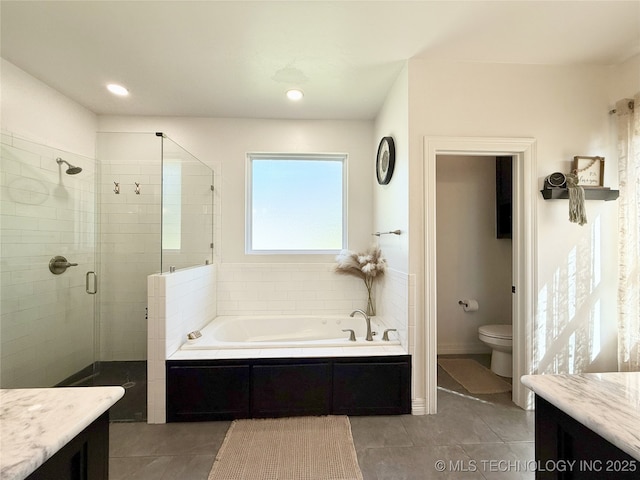 18040 County Road 1558, Ada, OK 74820 - full bathroom with a bath, a stall shower, tile patterned floors, vanity, and recessed lighting