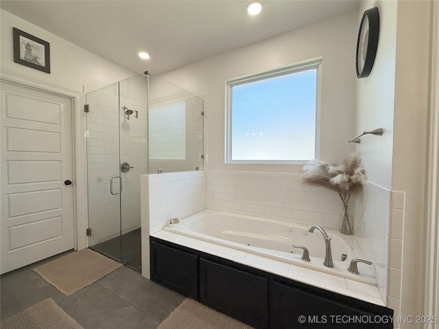 18040 County Road 1558, Ada, OK 74820 - full bath with a shower stall, a whirlpool tub, tile patterned flooring, and recessed lighting