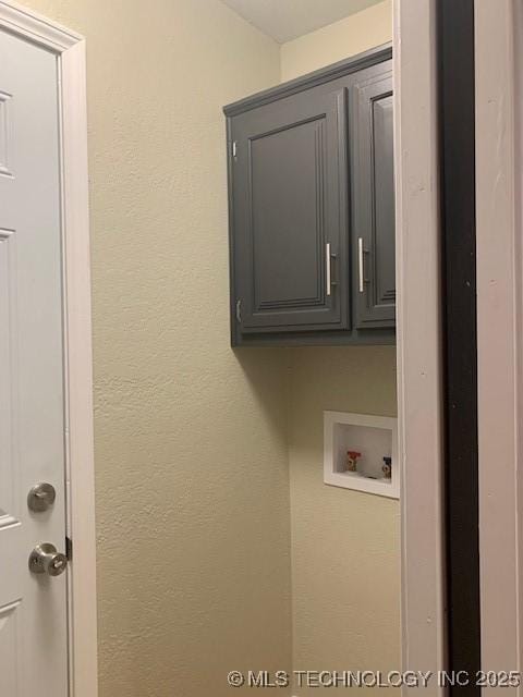 11810 E 83rd St, Owasso, OK 74055 - laundry room with washer hookup, cabinet space, and a textured wall