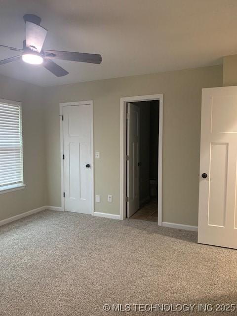 11810 E 83rd St, Owasso, OK 74055 - unfurnished bedroom with carpet, a ceiling fan, and ensuite bathroom