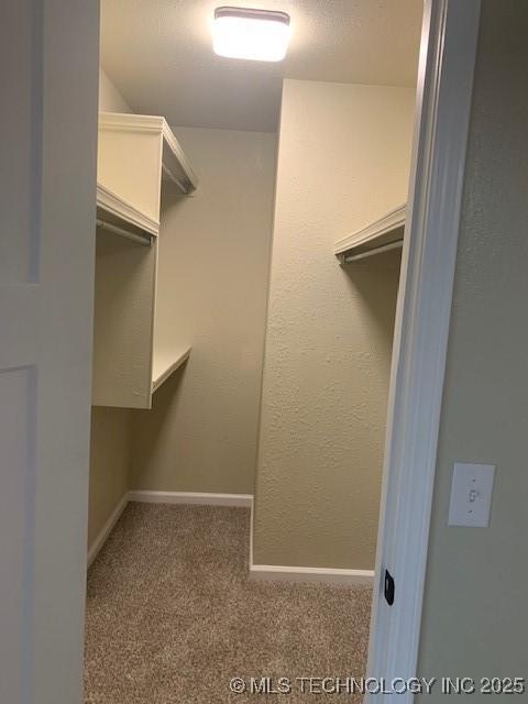 11810 E 83rd St, Owasso, OK 74055 - spacious closet featuring carpet floors