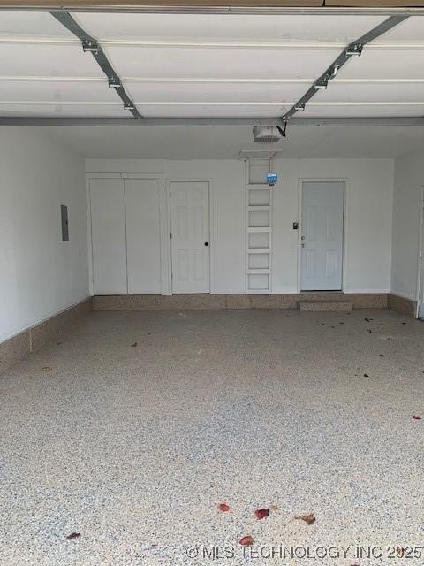 11810 E 83rd St, Owasso, OK 74055 - garage with electric panel and a garage door opener