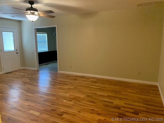 11810 E 83rd St, Owasso, OK 74055 - spare room featuring wood finished floors and ceiling fan
