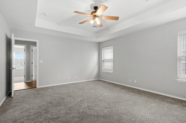 40 E Fairlane Pl, Sapulpa, OK 74066 - carpeted empty room with ceiling fan, a raised ceiling, and a smoke detector