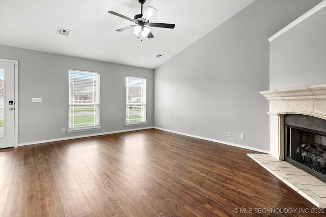 40 E Fairlane Pl, Sapulpa, OK 74066 - unfurnished living room featuring vaulted ceiling, wood finished floors, a ceiling fan, and a tile fireplace