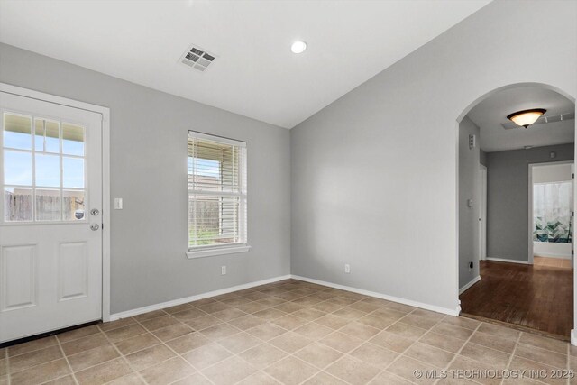 40 E Fairlane Pl, Sapulpa, OK 74066 - entrance foyer with arched walkways, vaulted ceiling, light tile patterned floors, and recessed lighting