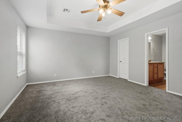 40 E Fairlane Pl, Sapulpa, OK 74066 - unfurnished bedroom with carpet, a raised ceiling, ensuite bath, and ceiling fan