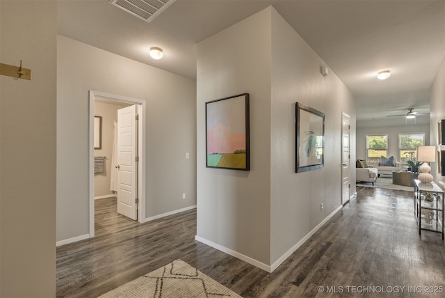 7420 E 160th Pl S, Bixby, OK 74008 - hall featuring dark wood-type flooring and baseboards