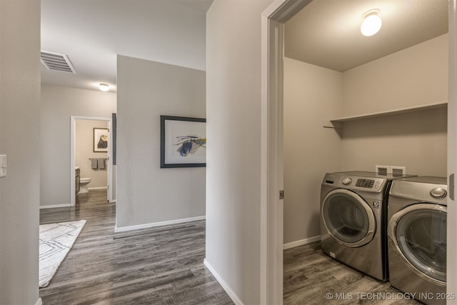 7420 E 160th Pl S, Bixby, OK 74008 - washroom with washer and dryer and dark wood-style flooring