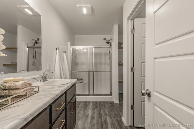 7420 E 160th Pl S, Bixby, OK 74008 - full bathroom with a stall shower, vanity, and wood finished floors