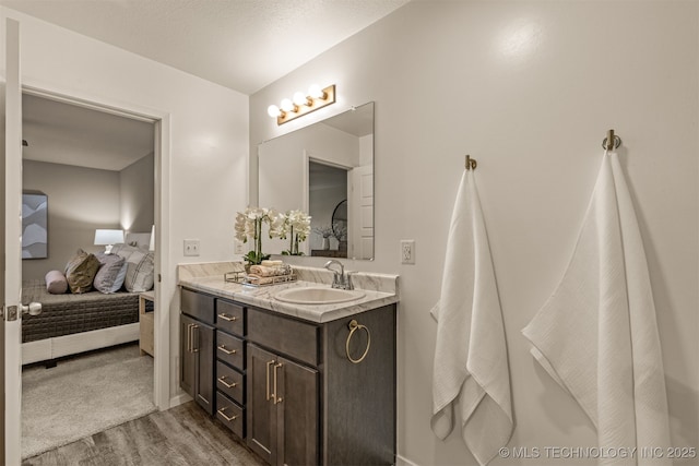 7420 E 160th Pl S, Bixby, OK 74008 - full bathroom with connected bathroom, wood finished floors, and double vanity