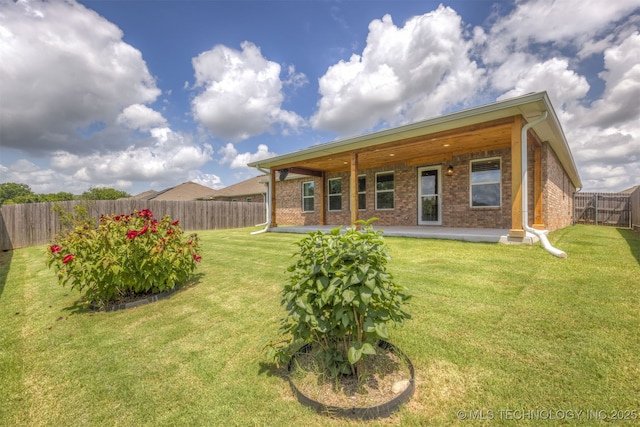 7420 E 160th Pl S, Bixby, OK 74008 - back of house featuring brick siding, a fenced backyard, and a patio