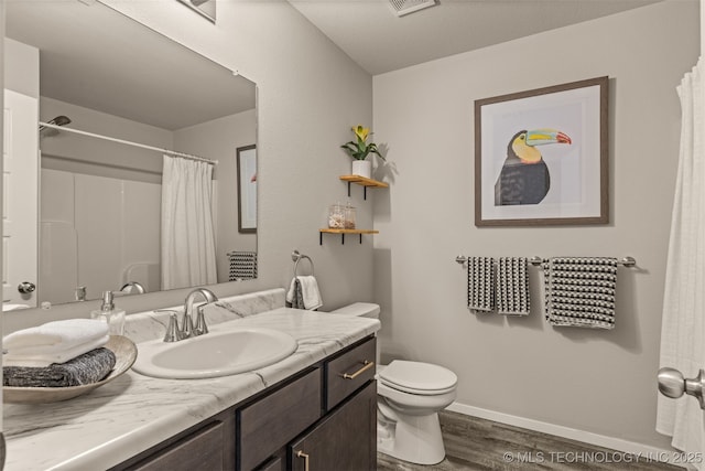 7420 E 160th Pl S, Bixby, OK 74008 - bathroom featuring wood finished floors, vanity, and a shower with shower curtain