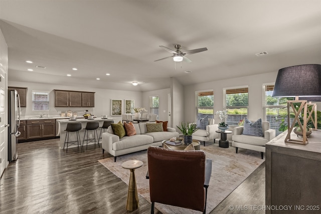 7420 E 160th Pl S, Bixby, OK 74008 - living room with plenty of natural light, recessed lighting, dark wood-type flooring, and a ceiling fan