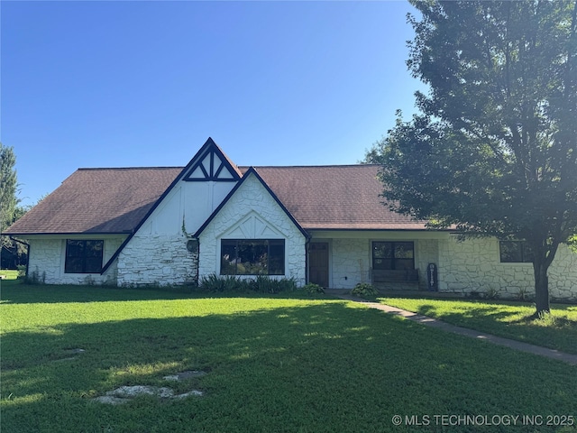 9858 N 38th Ave W, Sperry, OK 74073 - view of front of property with stone siding, a front lawn, and roof with shingles
