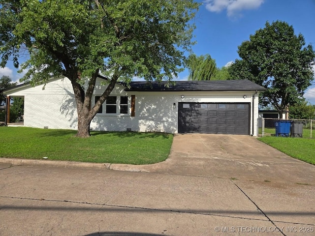 6706 E 28th Pl, Tulsa, OK 74129 - view of front of house featuring a garage, driveway, and brick siding