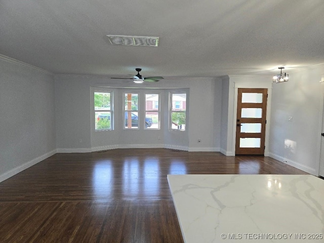 6706 E 28th Pl, Tulsa, OK 74129 - unfurnished living room with ceiling fan, dark wood-style flooring, crown molding, a chandelier, and a textured ceiling