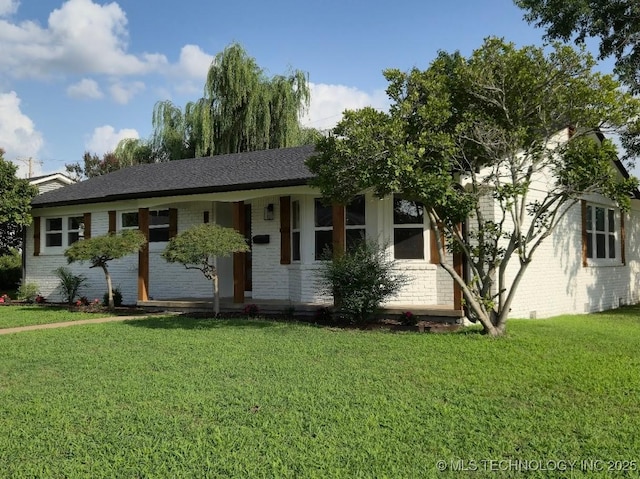 6706 E 28th Pl, Tulsa, OK 74129 - ranch-style house featuring brick siding and a front lawn