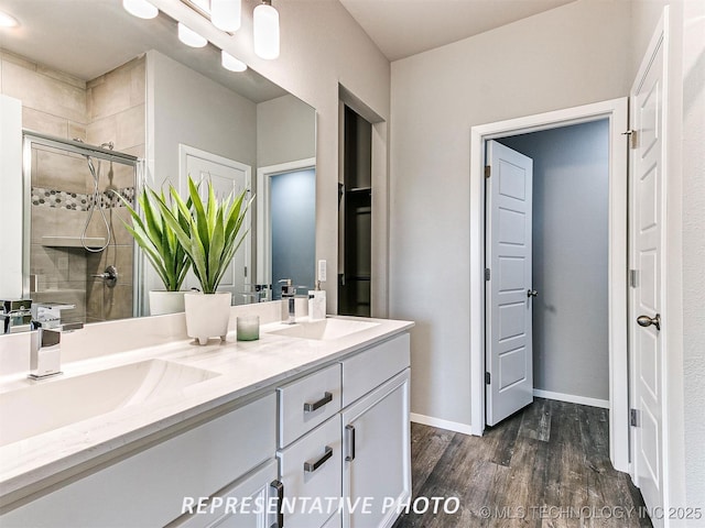 13413 S 72nd E Ave, Bixby, OK 74008 - bathroom with double vanity, a shower stall, and wood finished floors